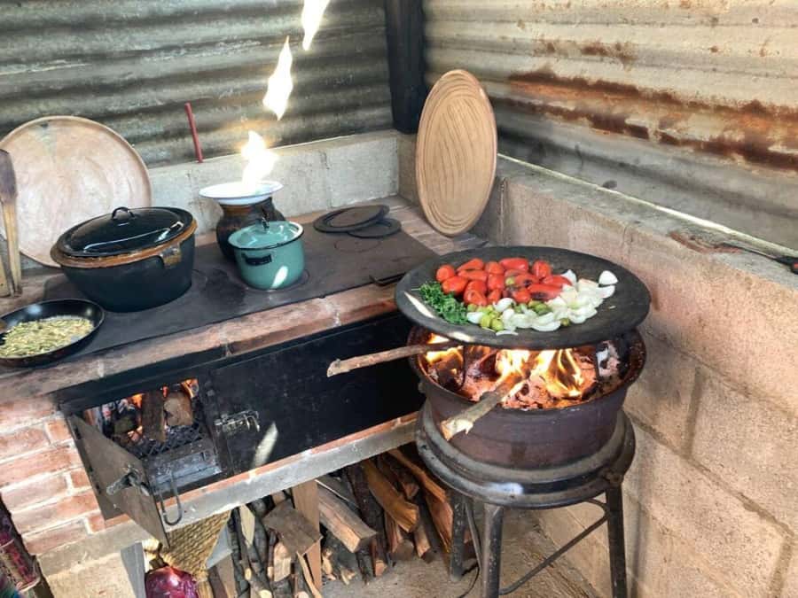 Antigua: Cooking Class with Local Family - Grinding corn and spices on the pedernal stone