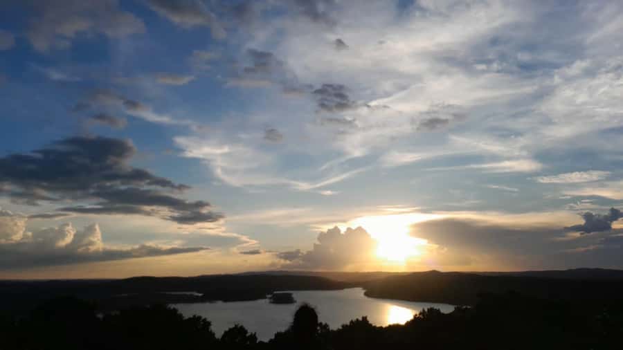 Flores: Yaxha Shared Sunset Tour with Transportation & Guide - The sunset at Structure 216